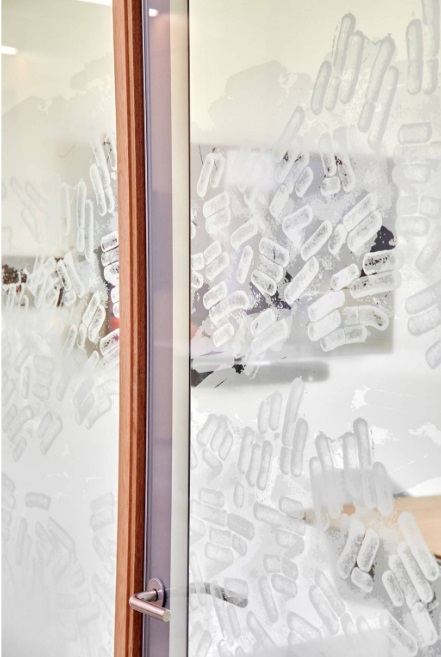 DEKO's minimalist and functional partition solutions in a detailed wooden design